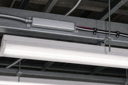 BAL500LPTD low-profile fluorescent emergency ballast installed above a commercial light fixture