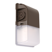Compact bronze LED wall pack with prismatic lens and integrated photocell for outdoor use
