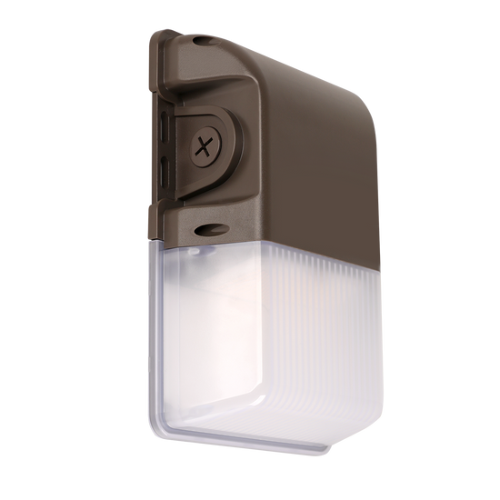 Compact bronze LED wall pack with prismatic lens and integrated photocell for outdoor use
