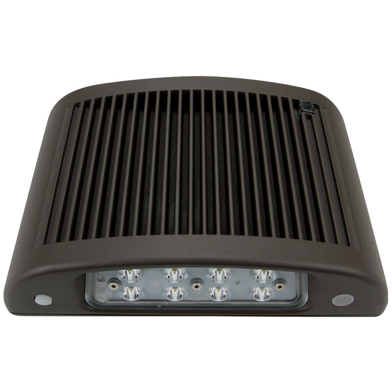 Slim LED wall pack with exposed lens and ribbed aluminum housing for thermal management