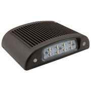 Slim LED wall pack with exposed lens and ribbed aluminum housing for thermal management