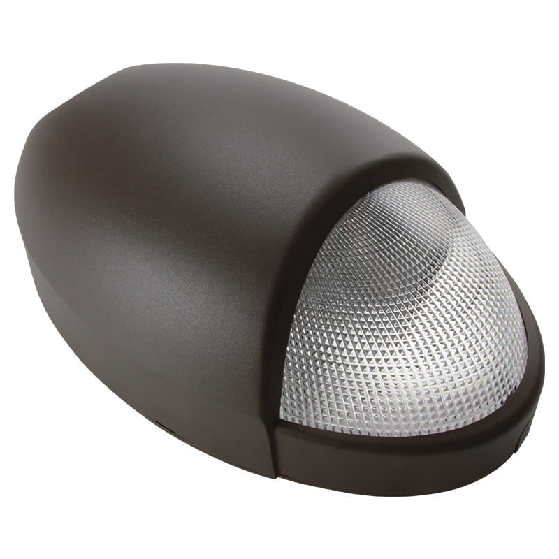 Wall-mounted emergency wallpack with prismatic lens and dusk-to-dawn output