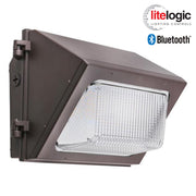 LED glass wall pack with Bluetooth-enabled LiteLogic sensor, shown with prismatic lens and bronze finish